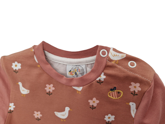 Maglietta con bottoni a manica lunga in cotone biologico – Malva con fantasia Papere