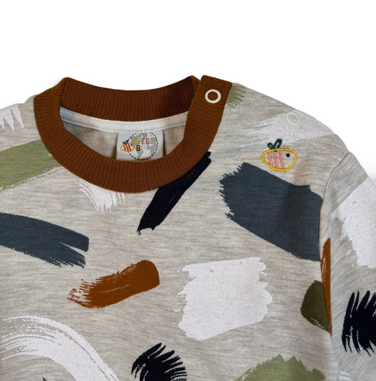 Felpa con bottoni in cotone biologico felpato – Fantasia Pennellate